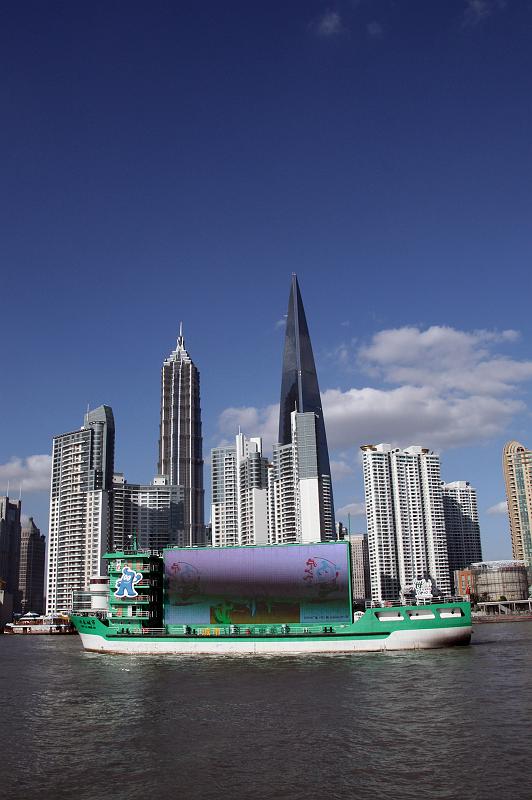 Pudong_View_13.jpg - Pudong: The ads boat, cruises up and down the river, just displaying some commercials.